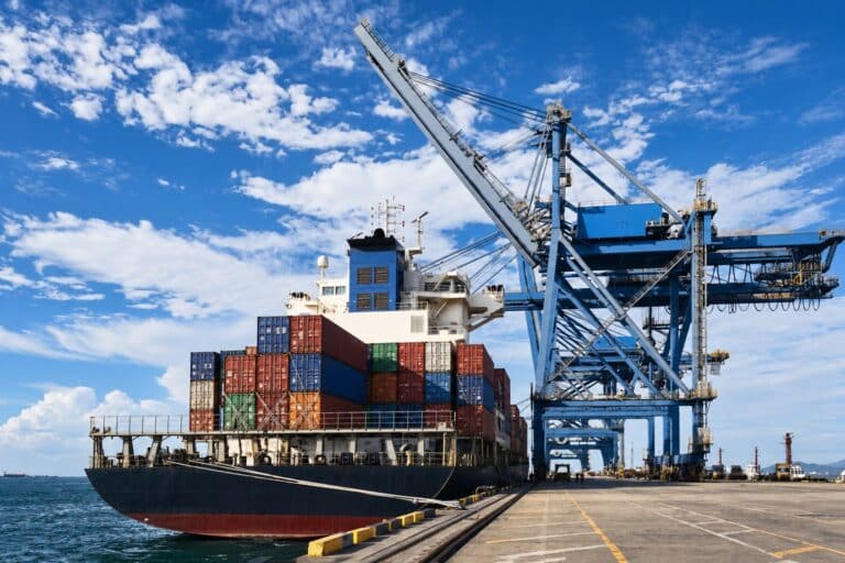 Container ship and gantry cranes at a port terminal