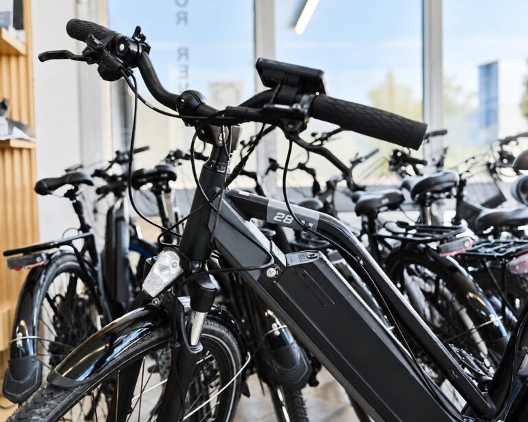 Electric bikes imported from China lined up in a warehouse